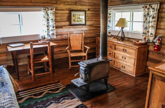 Wood-fired stove in bedroom of Hill Cabin 2 | Affordable dude ranch vacations | CM Ranch