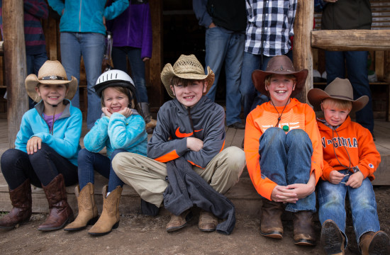 A group of young kids wearing cowboy hats and boots at CM Ranch in Dubois, WY | Wyoming dude ranch