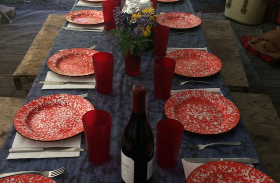 A table is set for dinner on a pack trip horseback riding in Wyoming near CM Ranch